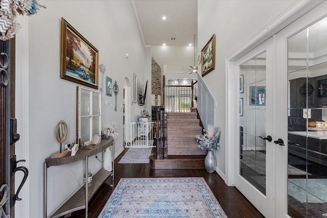 foyer with dark hardwood / wood-style floors and french doors