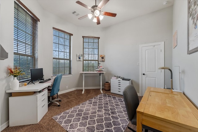 carpeted office with ceiling fan