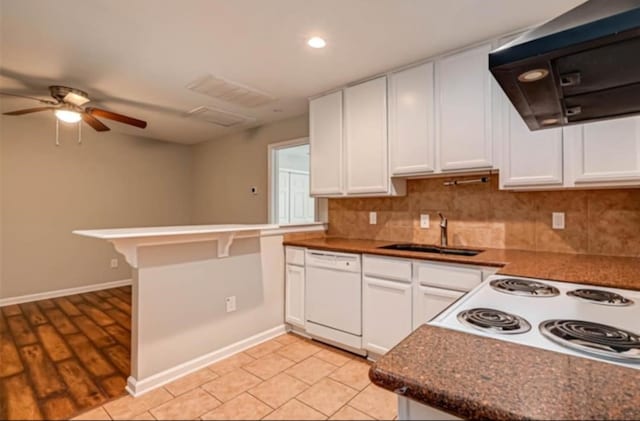 kitchen with white cabinetry, sink, white dishwasher, and range hood