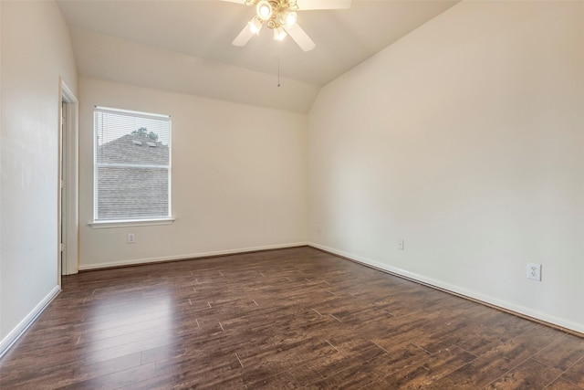 empty room with ceiling fan, lofted ceiling, and dark hardwood / wood-style flooring