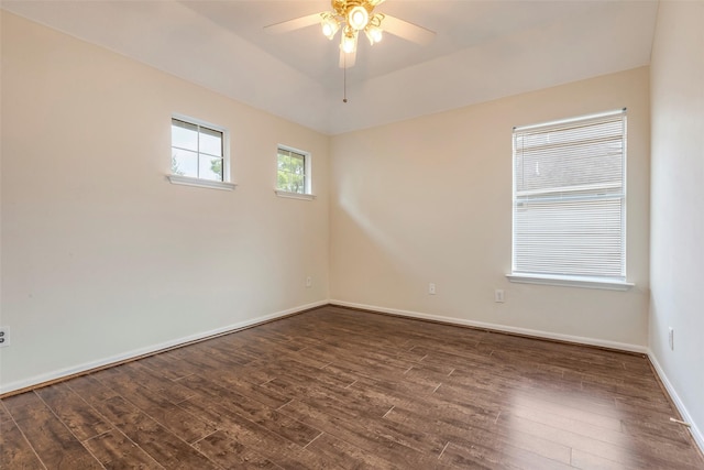 unfurnished room featuring ceiling fan and dark hardwood / wood-style floors