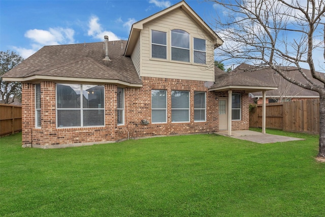 back of property featuring a patio area and a lawn