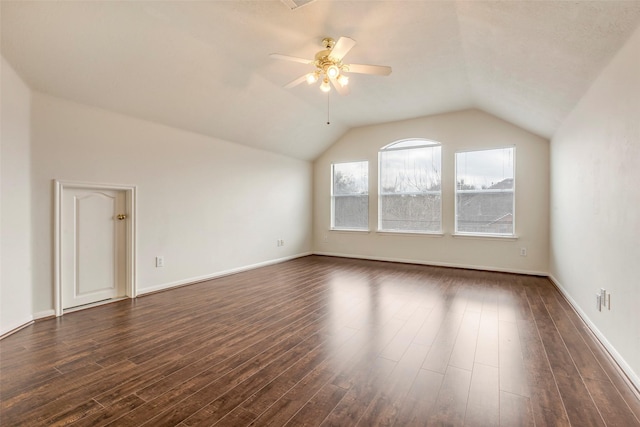 bonus room featuring ceiling fan, lofted ceiling, and dark hardwood / wood-style flooring