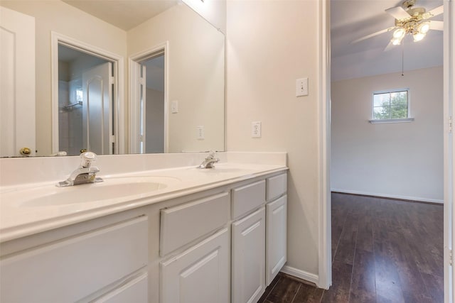 bathroom with vanity, hardwood / wood-style floors, and ceiling fan