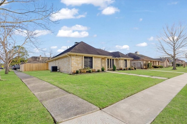 single story home featuring a front yard