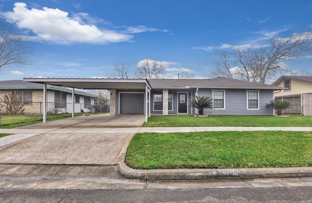 view of front of property with a carport, a garage, and a front yard