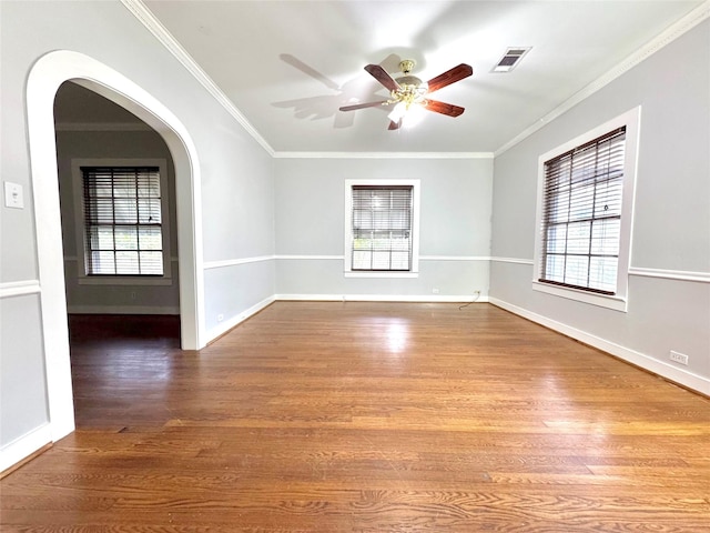 unfurnished room featuring hardwood / wood-style floors, plenty of natural light, and ornamental molding