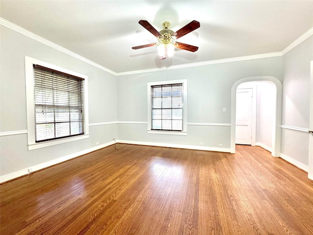 spare room featuring ornamental molding, ceiling fan, and light wood-type flooring