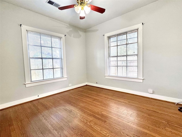 unfurnished room featuring hardwood / wood-style floors and ceiling fan