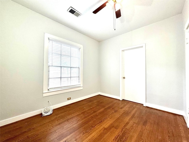 empty room featuring ceiling fan and wood-type flooring