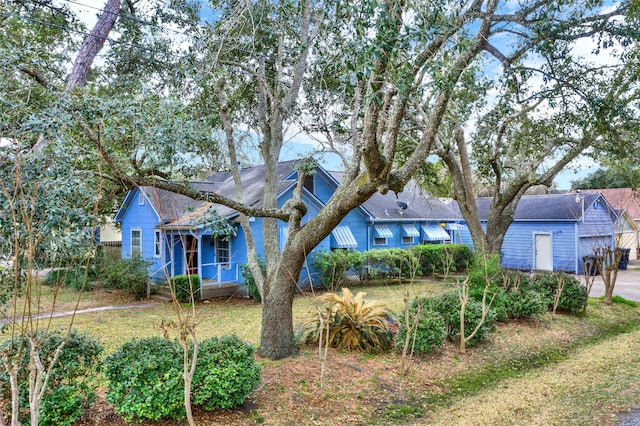 view of front of home with a garage and a front yard