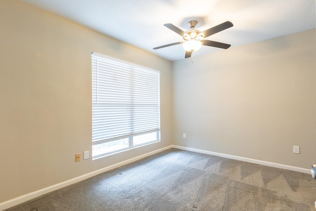 spare room with carpet flooring and ceiling fan