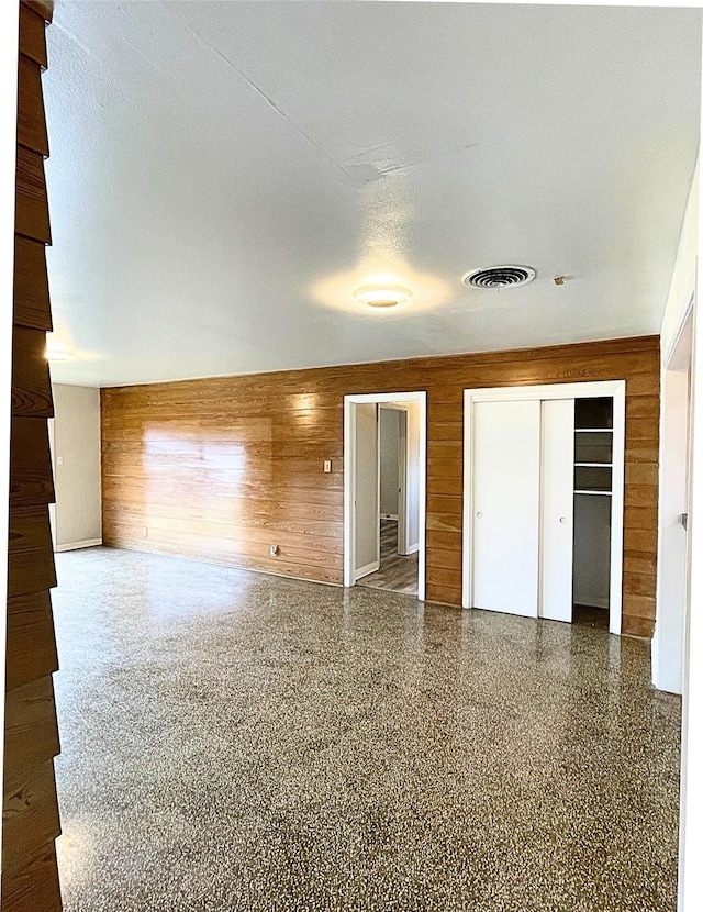 interior space featuring wood walls