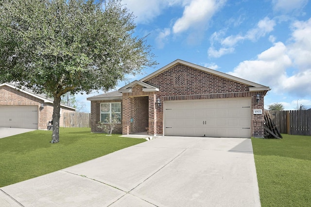 ranch-style house featuring a garage and a front yard