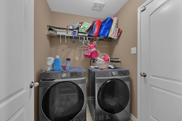 washroom featuring separate washer and dryer