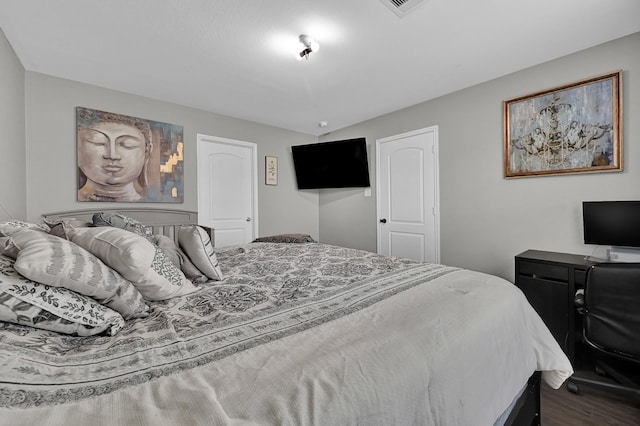 bedroom with hardwood / wood-style flooring