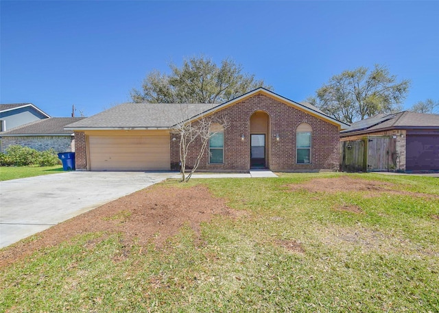 view of front of home with a garage, driveway, brick siding, and a front yard