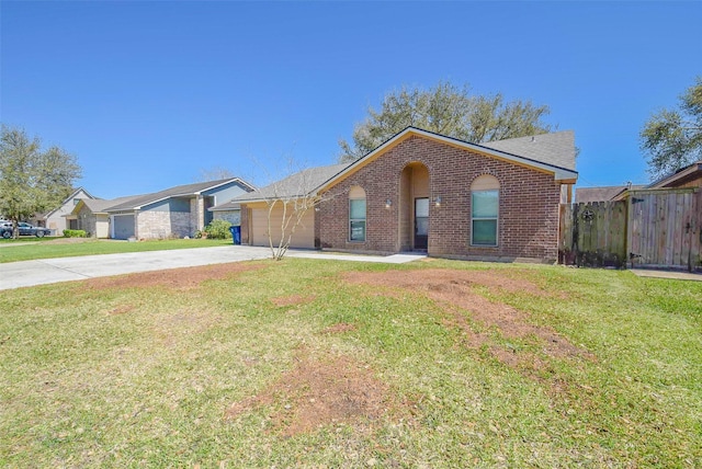 view of front facade with brick siding, an attached garage, driveway, and a front lawn