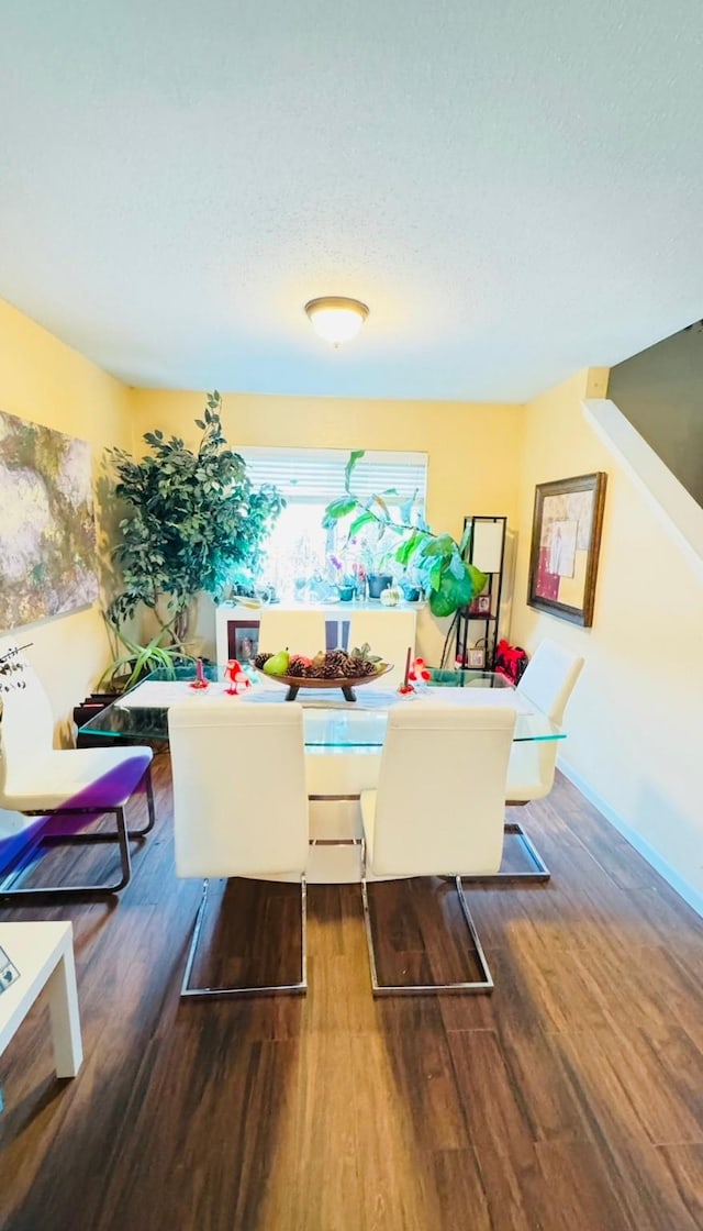 dining space featuring wood-type flooring