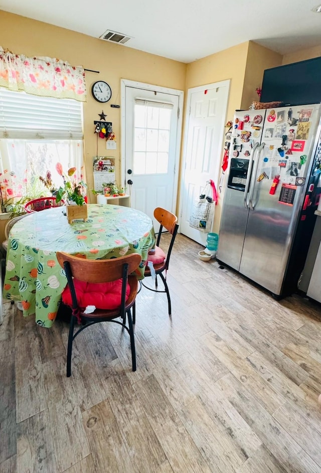 dining area with light hardwood / wood-style flooring