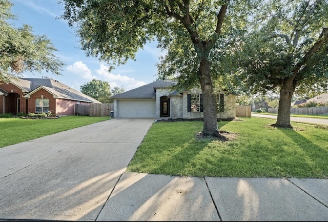 view of front of house featuring a garage and a front yard