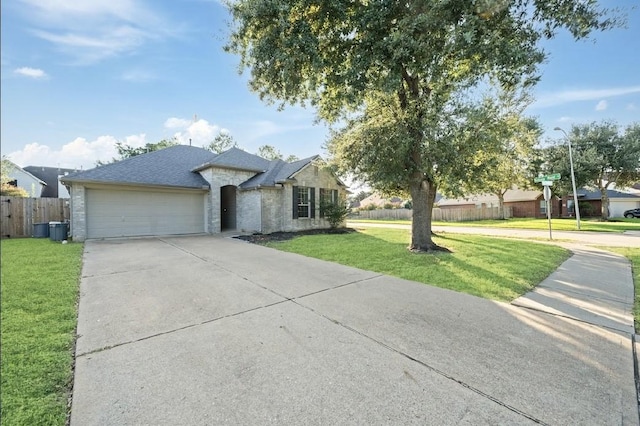 view of front facade with a garage and a front yard