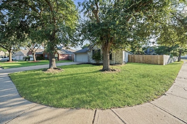 exterior space with a garage and a front lawn