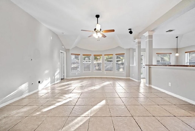 unfurnished living room featuring ornate columns, light tile patterned flooring, lofted ceiling, and ceiling fan