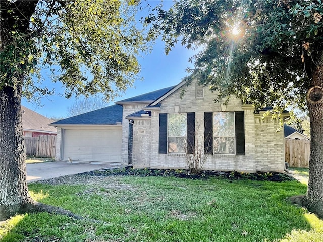 view of front facade with a garage and a front lawn