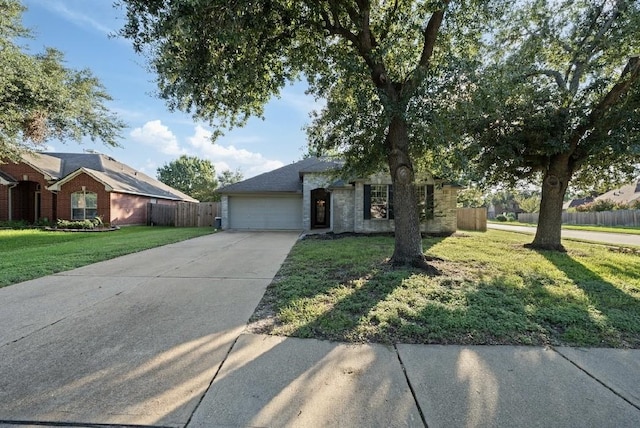 view of front of house featuring a garage and a front yard