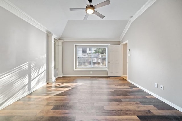 unfurnished room featuring crown molding, dark wood-type flooring, ceiling fan, vaulted ceiling, and ornate columns