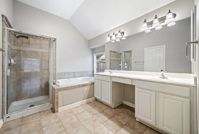 bathroom featuring lofted ceiling, vanity, tile patterned flooring, and plus walk in shower