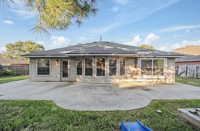 rear view of property featuring a patio area