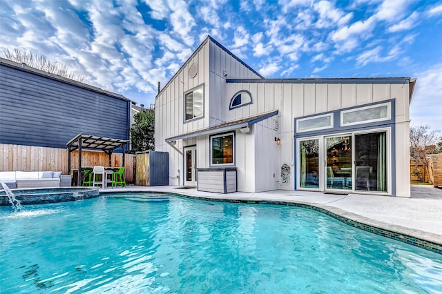 view of pool with a patio, a pool with connected hot tub, a pergola, and fence