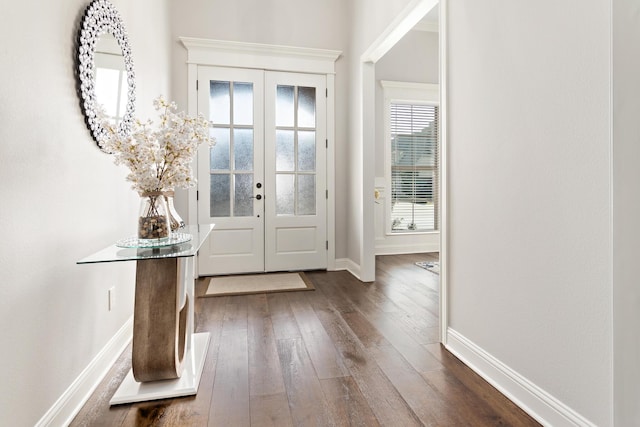 foyer entrance featuring dark wood-type flooring and french doors