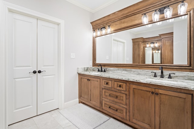 bathroom with crown molding, tile patterned floors, and vanity