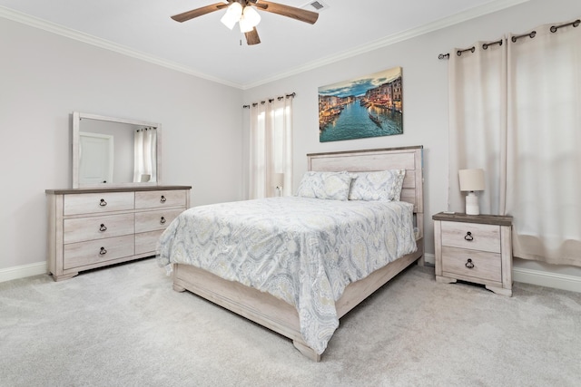 carpeted bedroom with crown molding and ceiling fan