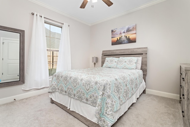 bedroom with ornamental molding, light colored carpet, and ceiling fan