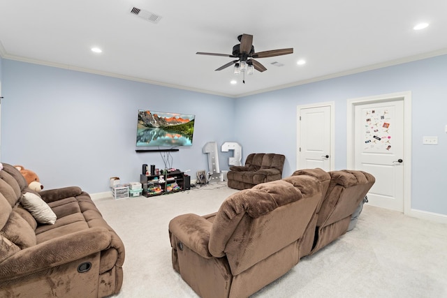 carpeted living room featuring ornamental molding and ceiling fan