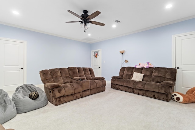 living room featuring ornamental molding, carpet floors, and ceiling fan