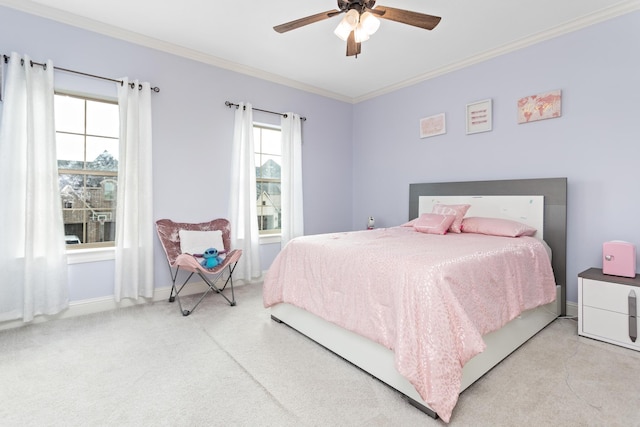 bedroom featuring crown molding, light carpet, and ceiling fan