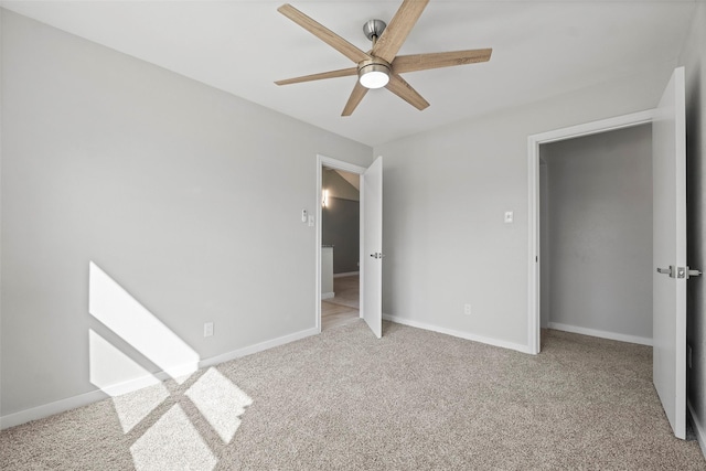 unfurnished bedroom with baseboards, ceiling fan, and light colored carpet