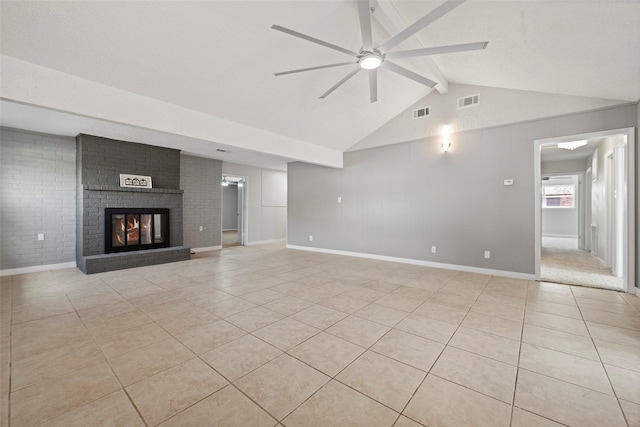 unfurnished living room with vaulted ceiling with beams, a fireplace, light tile patterned flooring, and a ceiling fan