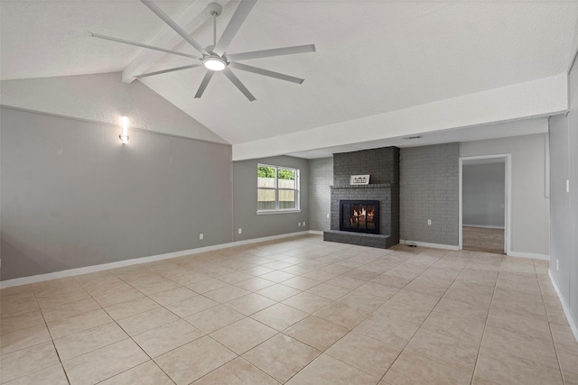 unfurnished living room featuring vaulted ceiling with beams, light tile patterned floors, a ceiling fan, a brick fireplace, and baseboards