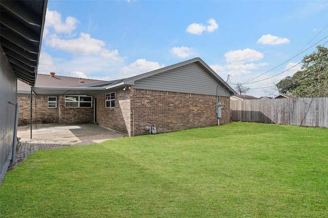 view of yard featuring a patio area and fence