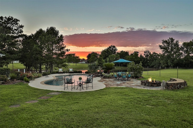 exterior space with a patio and an outdoor fire pit