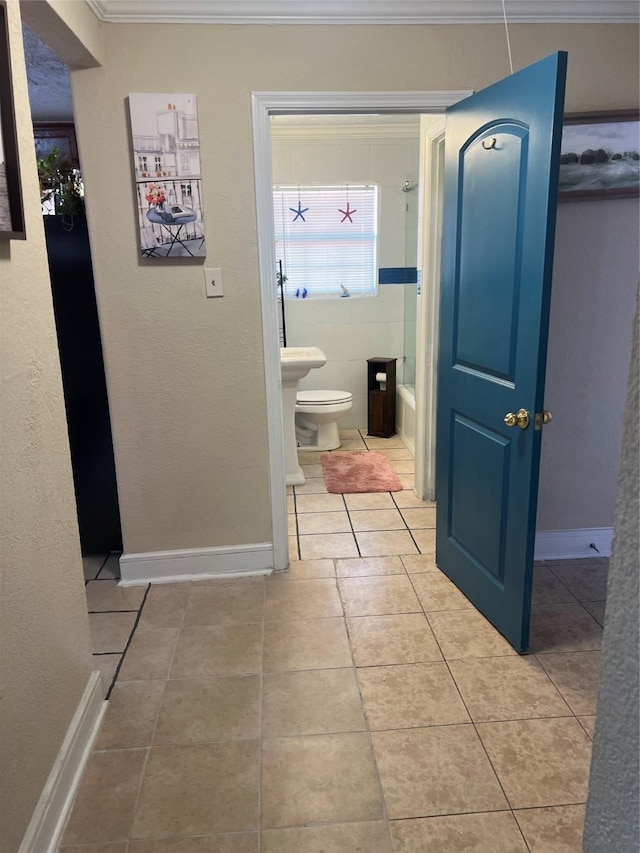 bathroom featuring light tile patterned floors and ornamental molding