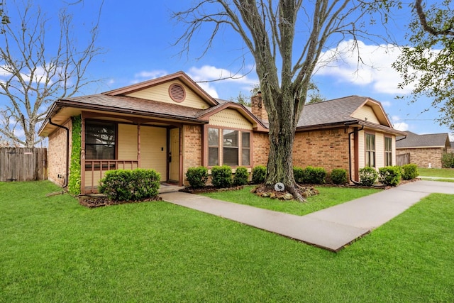 view of front of house featuring a porch and a front lawn