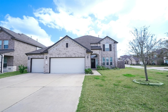 view of front of house featuring a garage and a front yard