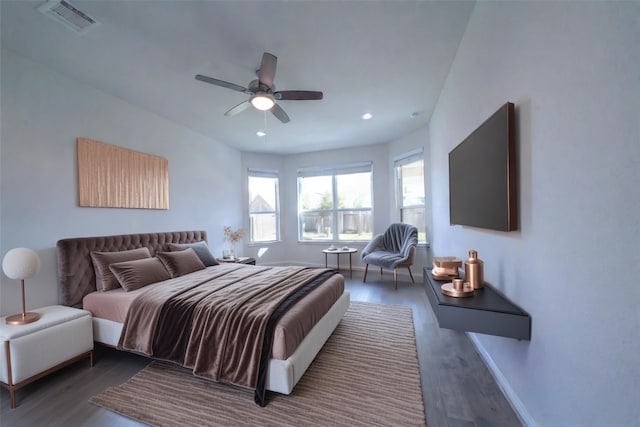 bedroom featuring ceiling fan, recessed lighting, wood finished floors, visible vents, and baseboards